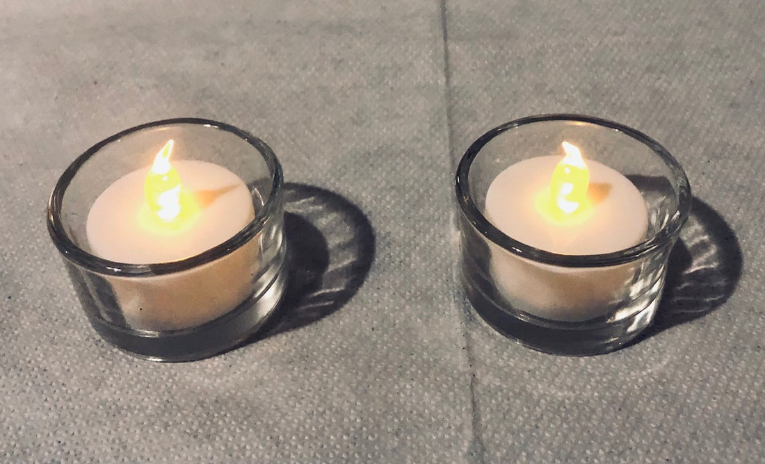 Pair of LED tea lights with holders